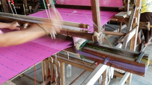 Thai traditional weaving by flying shuttle in Loei, Thailand  

