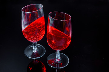Jelly in the glasses pieces with on the black background
