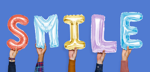 Hands showing smile balloons word