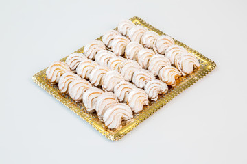 sugar cookies on a gold tray with white background