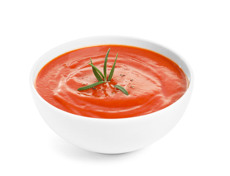 Bowl with fresh homemade tomato soup on white background