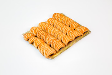moon cookies on a gold tray with white background