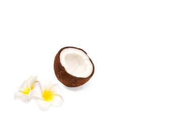 Obraz na płótnie Canvas Half of coconut and blossom isolated on white background