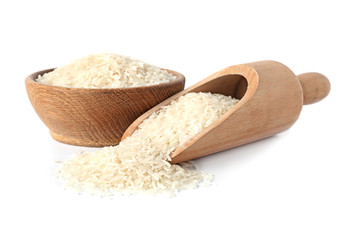 Bowl and scoop with uncooked long grain rice on white background