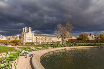 Dark clouds, thunderstorm, park in Paris center
