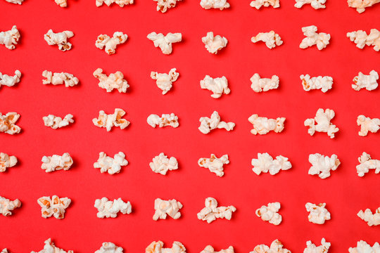 Flat lay composition with popcorn on color background