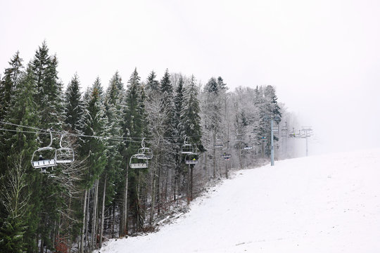 Beautiful landscape with ski lift at mountain resort. Winter vacation