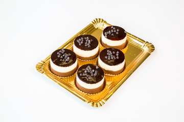 small chocolate cakes on a white background