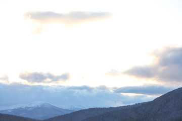 Obraz premium Beautiful mountain landscape with forest in winter
