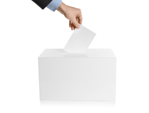 Man putting his vote into ballot box on white background, closeup