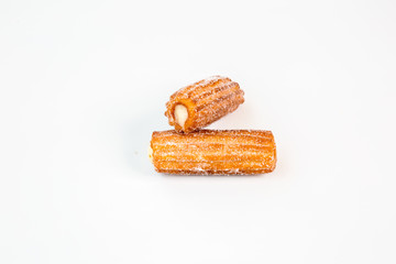 two sweet fritter churros with white background