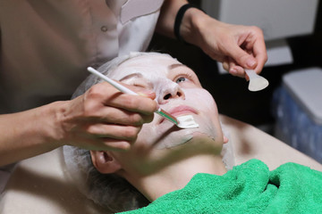 Face peeling mask, spa beauty treatment, skincare. 