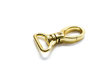Carabiner gold color isolated on white background. Metal fittings. View from above
