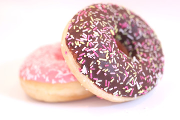 Chocolate and pink iced donuts