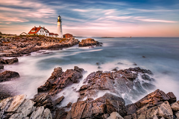 Portland Head light at dusk. The light station sits on a head of land at the entrance of the shipping channel into Portland Harbor. Completed in 1791, it is the oldest lighthouse in Maine - Powered by Adobe