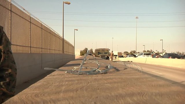 Soldiers replacing fencing sections in border area
