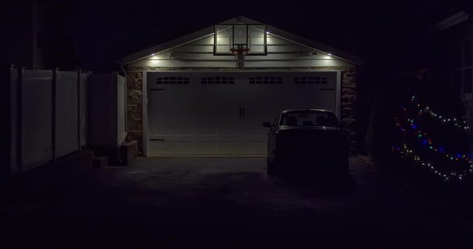 Static establishing shot of a garage with doors closed