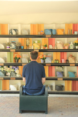 Man mourning  in a columbarium