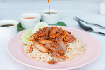 Barbecued red pork in sauce with rice