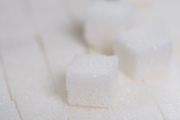 White sugar cube , sugar background