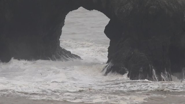 The Pacific Ocean. Swirling waves are on Pacific ocean after rain, Goat Rock Beach, Sonoma County, California winter. 
