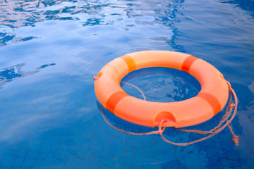 life ring floating in the empty swimming pool for relax peaceful the concept..