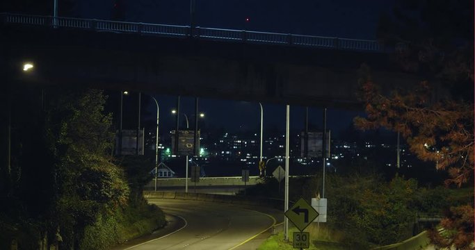 Intersecting Freeway and Road Timelapse at Night with Car Light Streak Trails