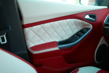 Car Doors. Car interior details. White red leather with stitching