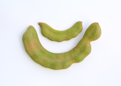 Fresh young green Tamarind (Tamarindus indica) isolated on white background.