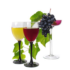 Two glasses of red and white wine and a bunch of grapes in a vase. Isolated on white