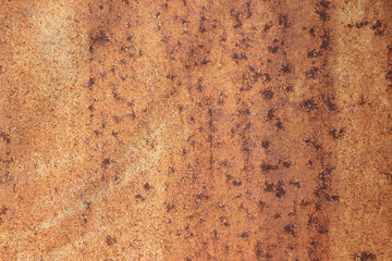 Rusty metal wall, old sheet of steel covered with rust and corrosion paint.