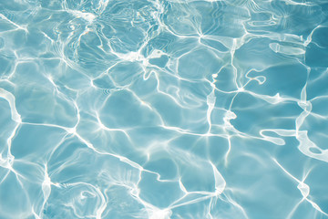 Texture of water in swimming pool for background