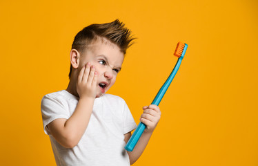 Little Asian boy suffering from toothache - Dental problem.