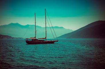 sailing boat in the sea at sunset in boka kotor bay in montenegro 