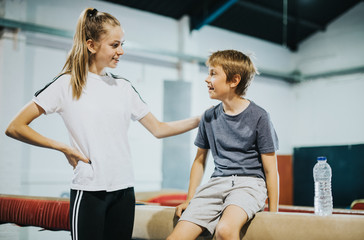 Coach talking to a young gymnast