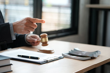 Lawyer Auction bid sale judgment mallet with judge. Auctioneer knocking down sale. © Charlie's
