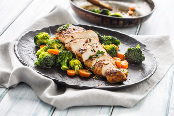 Roasted chicken breast with broccoli carrot and sesame