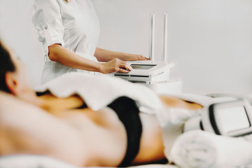 Close up photo of cryolipolysis fat treatment procedure equipmen