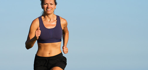 Woman runner running,training for marathon run