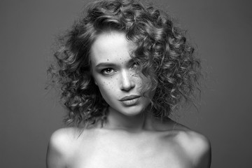 Beautiful freckles woman. amazing curly girl