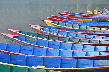 Blue boats on still lake