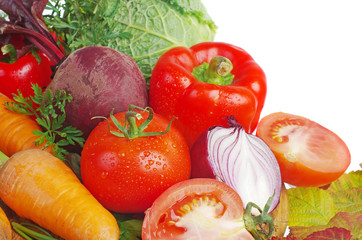 Vegetables on a white background. Cabbage, cucumbers, tomatoes, peppers, onions, carrots