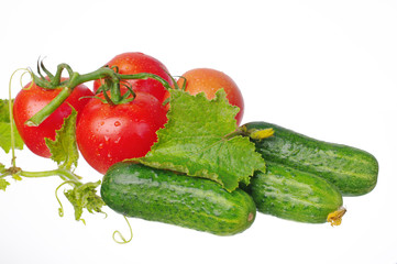 Vegetables on a white background. Tomatoes and cucumbers. Isolated on white