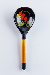 Khokhloma painting. Retro style - Russian old wooden spoon khokhloma painting on a white background.