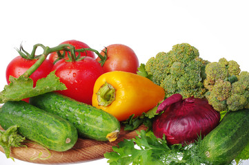 Vegetables on a white background. Cabbage, cucumbers, tomatoes, peppers, onions, garlic