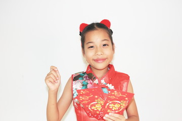Asian Chinese child happy showing red paper packet gift on isolated white background ,Chinese new year concept. 