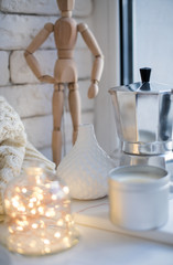 Obraz na płótnie Canvas Cozy winter interior styling and decor, warm string lights in bell jar