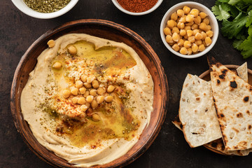 Classic Hummus with chickpeas, paprika, olive oil and oriental spices. Mediterranean popular snack of chickpeas and tahini pasta.