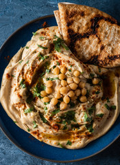 Classic Hummus with chickpeas, paprika, olive oil and oriental spices. Mediterranean popular snack of chickpeas and tahini pasta