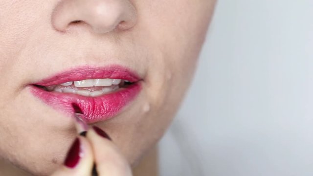Red Lipstick. Closeup Of Woman Face With Bright Red Lipstick On Full Lips. Beauty Cosmetics, Makeup Concept